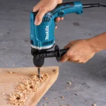 HP1630 electric impact drill with 16mm keyed chuck, twist drill bit, T-handle chuck key and auxiliary side handletoolstationpakistan, toolstation.com