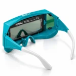 TOTAL TSP9405 auto-darkening welding goggles with teal frame, clear protective lens, and adjustable white armstoolstationpakistan, toolstation.com