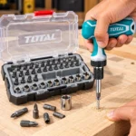 TOTAL screwdriver bit set with teal T-handle, multiple screwdriver bits and chrome sockets in an open storage case.toolstationpakistan, toolstatin.com