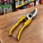 Professional gold garden pruning shears cutting a rose branchtoolstationpakistan, toolstation,com