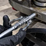 Double handle spring-loaded grease gun coupler with serrated jawstoolstationpakistan, toolstation.com